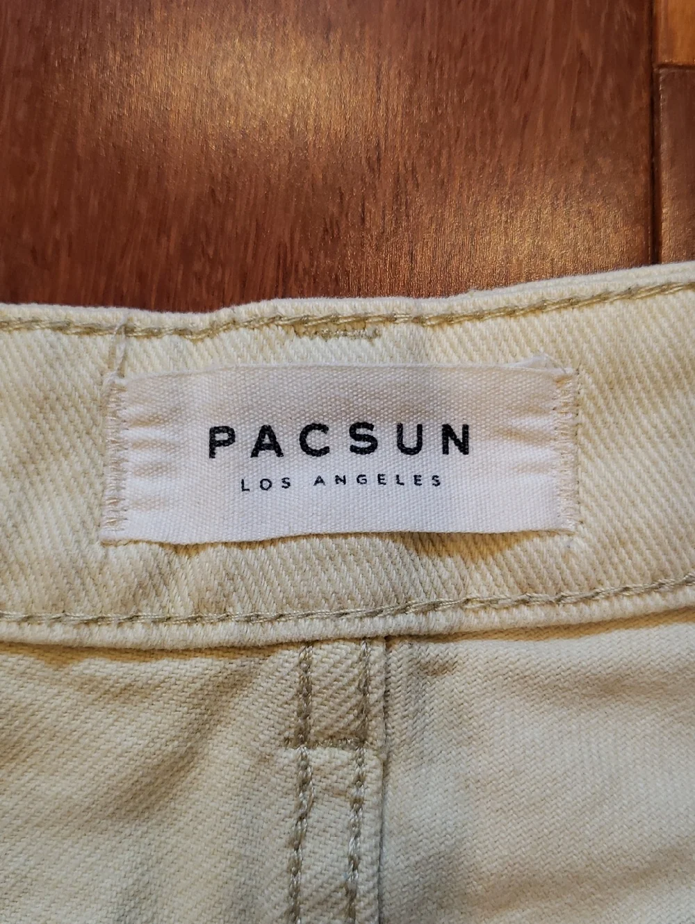 Pac Sun Women's size 26 Mom Short. Light yellow destructed denim jean